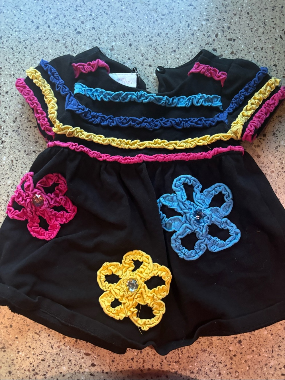 Bonnie Baby Black Top with Pink, Blue & Yellow Ruffle Flowers